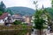 Vianden, Luxembourg - July 27, 2019: Vianden Castle on a hill with a bridge, a restaurant and Our river in Vianden, Luxembourg