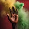 A Vibrant African Raised Hand Amidst Red, Yellow, and Green Smoke