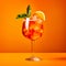A vibrant Aperol Spritz cocktail garnished with orange slice and ice cubes