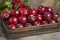 Vibrant apple harvest in lush garden, fresh fruits amidst verdant foliage and blossoming flowers