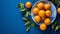 Vibrant array of juicy tangerines in a bowl on a blue background. AI-generated.