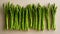 Vibrant asparagus spears on minimalist wooden board, sharp focus fujifilm xt4 f 5.6