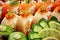 Vibrant assorted sushi rolls with salmon, avocado, mamenori, tobiko