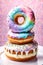 Vibrant assortment of colorful donuts stacked on plate, tempting, delicious treats. For advertise cafe, pastry shop