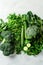Vibrant Assortment of Fresh Green Vegetables on Light Background