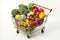 Vibrant assortment of fresh produce in fully stocked supermarket cart on white background