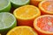 A vibrant assortment of oranges and limes, sliced in half, arranged neatly for a refreshing display of citrus fruits, A bold and