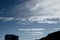 A Vibrant atmospheric cloudy sky cloudscape with white coloured wispy cirrus cloud formation in a mid blue sky