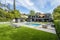 Vibrant backyard outdoor scene featuring lush artificial grass, a pristine pool