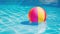 Vibrant beach ball floats peacefully on calm blue pool waters, inviting play. Ai Generated