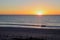 Vibrant beach scene captured at sunset.