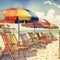 Vibrant Beach Scene with Colorful Umbrellas and Chairs Perfect for Summer Getaways .