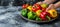 Vibrant bell peppers held in hand, selective focus with copy space on blurred background