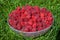 Vibrant Berry Delight: Close-Up Top View of a Plate Overflowing with Ripe Fresh Red Raspberries