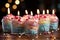 Vibrant birthday dessert, candles aglow delectable and enticing on a white canvas