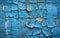 A vibrant blue wall displays an elaborate network of cracks, hinting at the underlying layers of history and neglect.