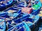 Vibrant blue wooden boats lined up in the harbor