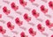 Vibrant, bold coloured pattern made of pink flower floating above pastel background. Minimal Spring or Summer concept. Modern