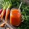 Vibrant carrot juice glows in rustic mason jar, farm fresh delight