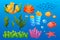 Vibrant Cartoon-style Underwater World Elements. Colorful Coral Reefs, Playful Marine Life, Fish Shoal, Starfish, Algae