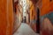 Vibrant Cityscape: A Narrow Alleyway With Orange Walls, Narrow, winding streets of a historic Islamic town in Morocco, AI