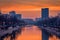 Vibrant cityscape shot early morning before sunrise in Bucharest with a river in the foreground with ducks swimming