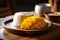 Vibrant Close-Up of Mango Sticky Rice Dessert in Ambient Light