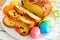 Vibrant color holiday background. Still life with Easter eggs and traditional cake