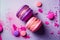 Vibrant colored pastel French macaroons in strawberry and berry flavours