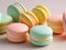 Vibrant colored pastel French macaroons in strawberry, lemon and mint flavours