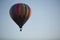 Vibrant, colorful, hot air balloon during sunrise