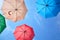 Vibrant colorful opened umbrellas in the sky background