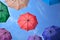 Vibrant colorful opened umbrellas in the sky background