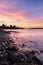 Vibrant colorful sunrise over Burrard Inlet in West Vancouver with the Lions Gate Bridge in the background