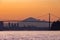 Vibrant colorful sunrise over Burrard Inlet in West Vancouver with the Lions Gate Bridge in the background