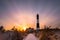 Vibrant colorful sunset as clouds streak across the sky. Fire Island Lighthouse, New York