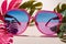 Vibrant colorful tropical vacation theme, with pastel blue and pink sunglasses