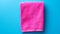 Vibrant Colorist: Pink Towel On Blue Surface With Copy Space