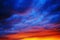 Vibrant colors in clouds by sunset glow