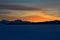 Vibrant colourful dawn sky sunset over mountain in winter with tromsoe city island