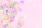 Vibrant confetti on pastel pink background