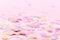 Vibrant confetti on pastel pink background