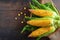 Vibrant corn showcase on wooden backdrop, embodying the essence of harvest