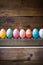 A Vibrant Display of Colored Eggs on a Rustic Wooden Table