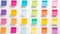 A vibrant display of colorful sticky notes arranged in rows on a white background