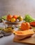 A vibrant display of fresh vegetables and a bowl of soup