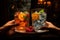 A vibrant display of glistening glassware filled with colourful fruit and a flourishing houseplant bathes the indoor table