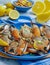 A vibrant display of mediterranean-style blue crabs, cooked to perfection, with a hint of lemon.