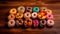 Vibrant Donut Medley: Assorted Colorful Treats on a Dark Background