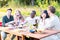 Vibrant Evening Garden Party with Multi-Ethnic Millennial Friends Having Conversations and Fun